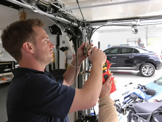 Seven Hills Garage Door Repair safety certified technician performing cable replacement in Seven Hills